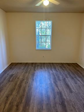 Deltona apartment for rent - A room with a window and wooden flooring.