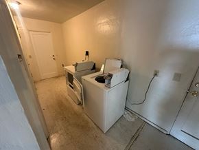 Pasco apartment for rent - A room with a washing machine and dryer in it.