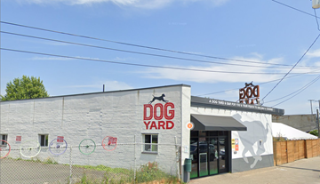 Seattle apartment for rent - A building with a sign that says Dog Yard.