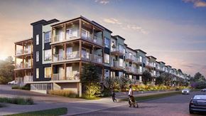 Calgary apartment for rent - A row of modern townhouses with balconies and a person walking a dog.
