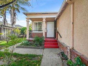 San Leandro apartment for rent - A house with a red carpeted entrance and a white door.