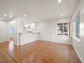 San Leandro apartment for rent - A room with wooden floors and white walls.