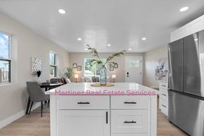 Denver house for rent - A modern kitchen with a dining area and a large island.