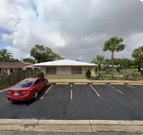 Fort Lauderdale apartment for rent - A red car is parked in a parking lot.