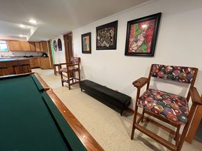 Manvel apartment for rent - A room with a pool table and a chair.