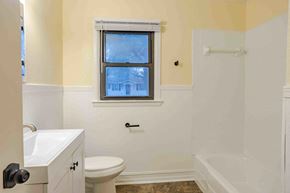 Lafayette house for rent - A bathroom with a toilet, sink, and bathtub.