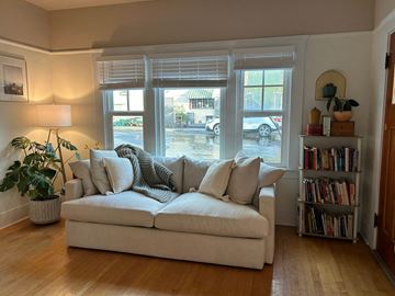 San Luis Obispo apartment for rent - A living room with a white couch and a potted plant.