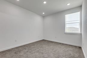 San Antonio apartment for rent - A room with a carpeted floor and a window with blinds.