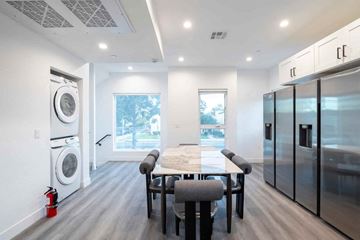 Los Angeles apartment for rent - A modern kitchen with a dining table and chairs.
