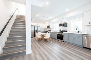 Los Angeles apartment for rent - A modern kitchen with a staircase on the left side.