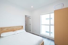 Los Angeles apartment for rent - A bedroom with a bed, a dresser, and a window.