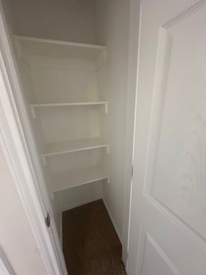 Big Spring apartment for rent - Empty white shelves in a white pantry.
