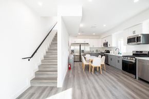 Los Angeles apartment for rent - A modern kitchen with a staircase leading to the upper floor.