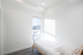 Los Angeles apartment for rent - A bedroom with a bed and a window.