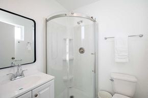Los Angeles apartment for rent - A white bathroom with a sink, toilet, and shower.