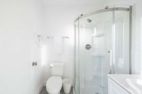 Los Angeles apartment for rent - A white toilet sits next to a white sink in a bathroom.