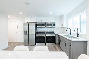 Los Angeles apartment for rent - A modern kitchen with a refrigerator, oven, and microwave.