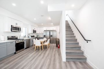 Los Angeles apartment for rent - A modern kitchen with a dining table and chairs.