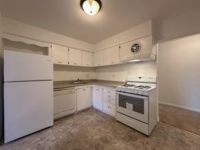 Fairless Hills apartment for rent - A room with a wooden floor and a door leading to a balcony.
