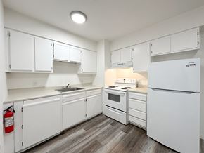 Reading apartment for rent - A room with a wooden floor and white walls.