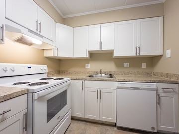Prospect Park apartment for rent - A kitchen with white cabinets and appliances.