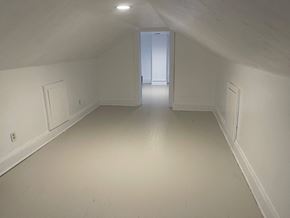Akron house for rent - A white room with a door at the end.
