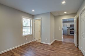 Boone house for rent - A room with wooden floors and white walls.