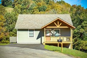 Boone house for rent - A small house with a porch and a mailbox on it.