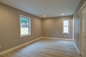 Boone house for rent - A room with light brown walls and a wooden floor.