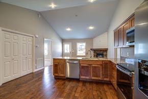 Boone house for rent - A kitchen with wooden floors and stainless steel appliances.
