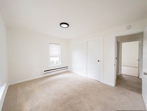 Paulsboro apartment for rent - A white bathroom with a sink, toilet and bathtub.