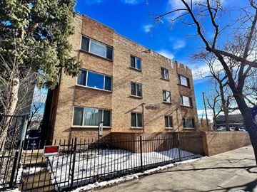 Denver apartment for rent - A brick building with a sign that says "The Birney".