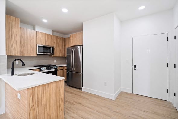 Elizabeth apartment for rent - A kitchen with wooden cabinets and stainless steel appliances.