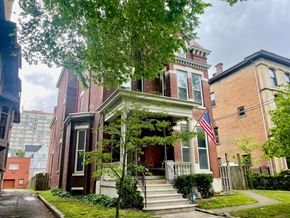 Louisville apartment for rent - A house with a flag on the front porch.