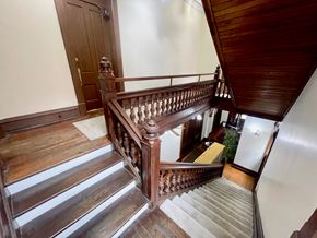 Louisville apartment for rent - A wooden staircase with a metal railing.