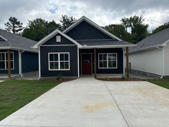 Little Rock house for rent - A blue house with a red door and windows.