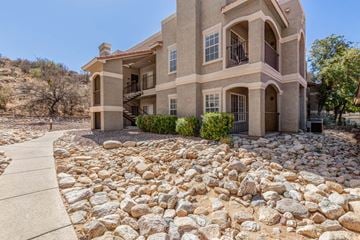 Tucson house for rent - A house with a stone pathway in front of it.