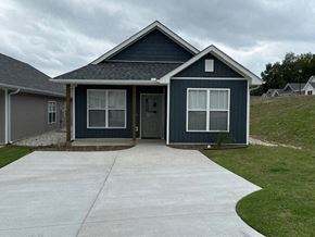 Little Rock house for rent - A small house with a grey roof and a blue exterior is shown.