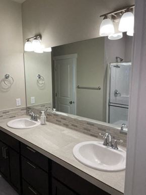 Hermiston house for rent - A bathroom with a sink and mirror.