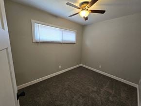 Gary house for rent - A room with a ceiling fan and a window with blinds.