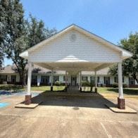 Cheneyville apartment for rent - A white covered walkway leads to a building.