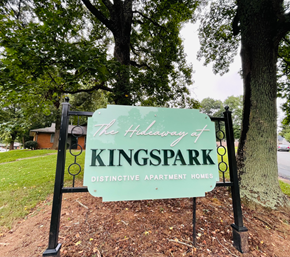 Charlotte apartment for rent - A sign that says "The Holloway of Kingspark Distinctive Apartment Homes" is in front of a tree.