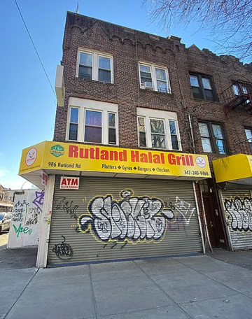 Brooklyn apartment for rent - A building with a Rutland Halal Grill sign on the front.