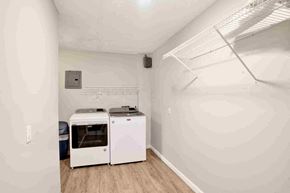 Gulf Shores house for rent - A white kitchen with a dishwasher and an oven.