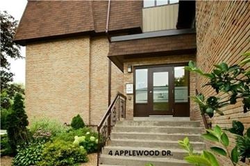 Belleville apartment for rent - A building with a glass door and a sign that says 4 Applewood Dr.
