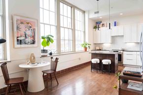 Cleveland apartment for rent - A kitchen with a table and chairs in front of a window.
