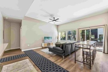Glendale apartment for rent - A living room with a grey couch and a black and white rug.