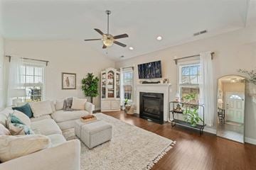 Jacksonville house for rent - A living room with a white couch and a fireplace.