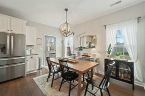 Jacksonville house for rent - A dining room with a wooden table and chairs.
