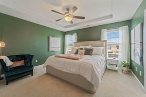 Jacksonville house for rent - A bedroom with a large bed and a green wall.